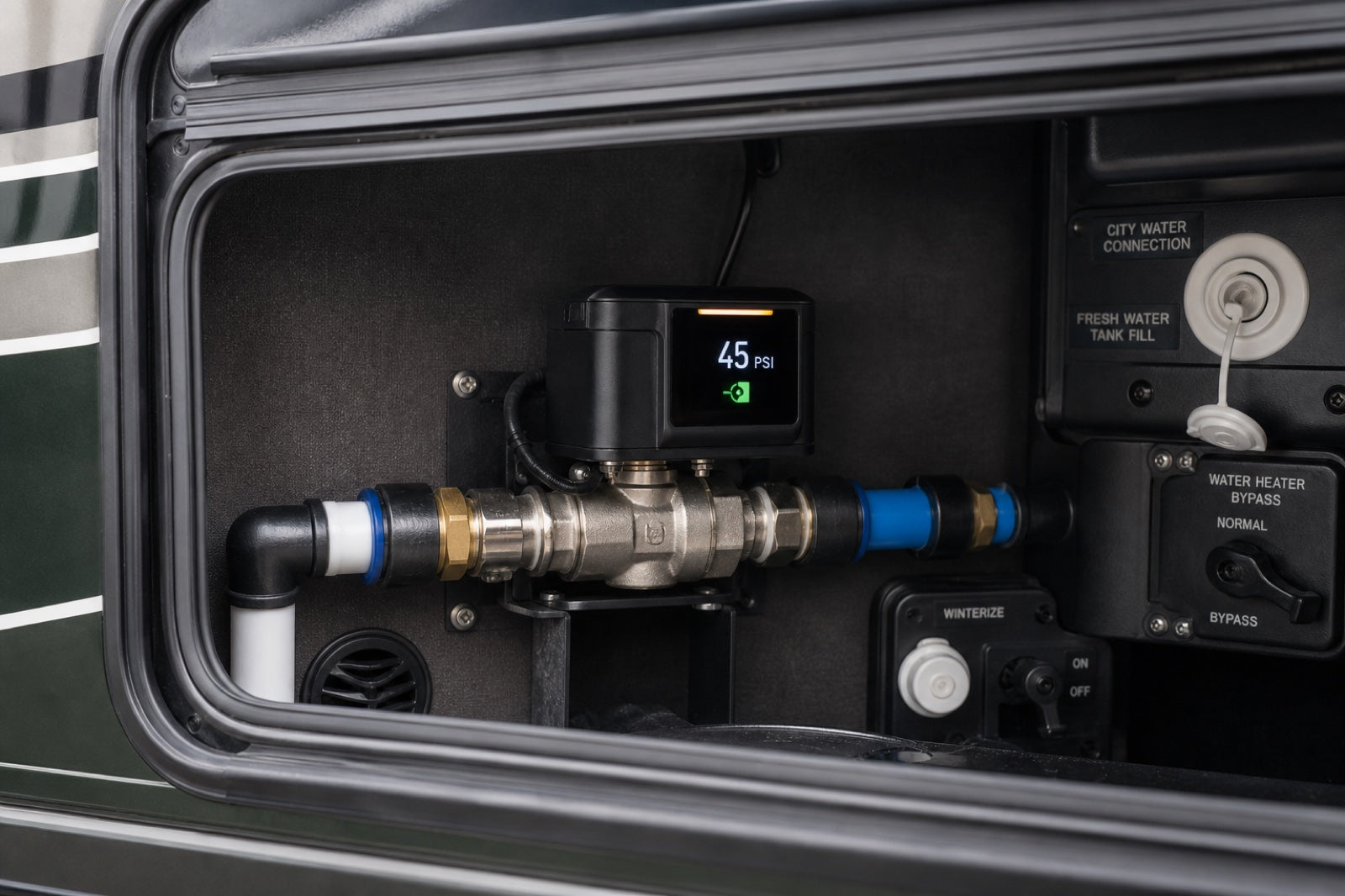 Smart motorized water valve with a digital pressure display installed in an RV utility bay