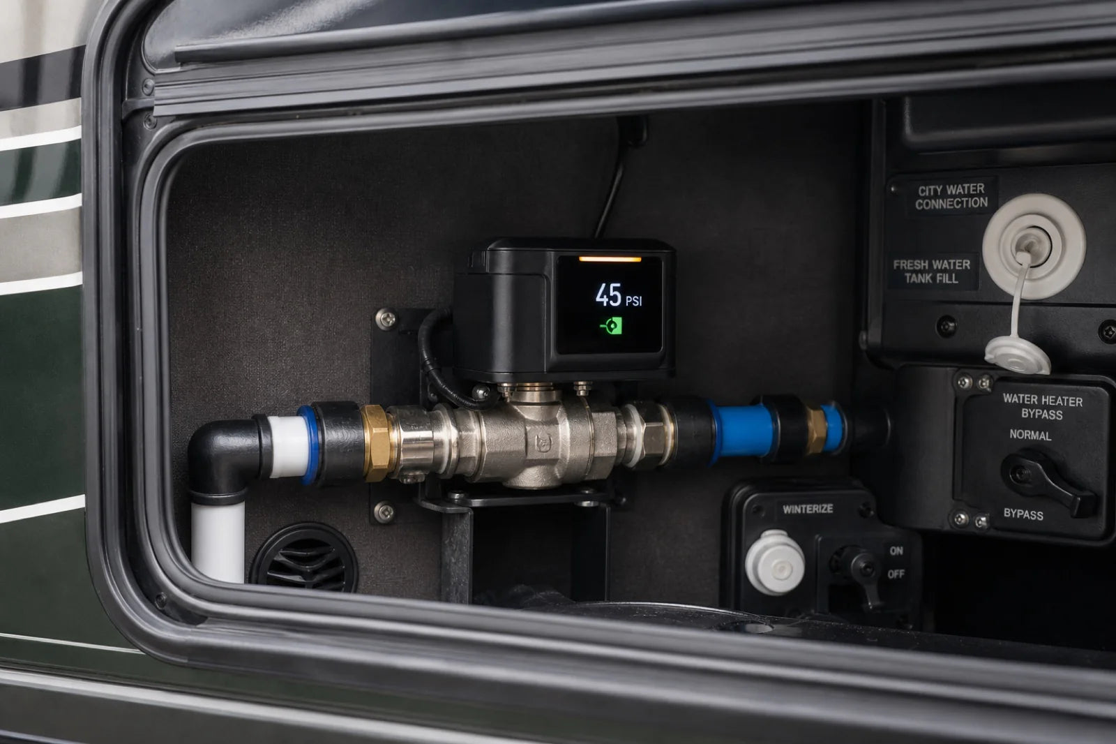 Smart motorized water valve with a digital pressure display installed in an RV utility bay